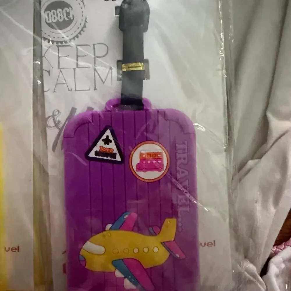Purple luggage tag with yellow plane